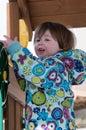 Happy toddler girl in warm coat on on snow day and having a fun in the winter outside, outdoor portrait Royalty Free Stock Photo