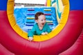 Happy toddler peeking on trampoline Royalty Free Stock Photo