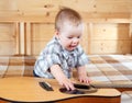 Happy toddler playing guitar Royalty Free Stock Photo