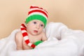 Happy toddler. Smiling infant in red cap. Kid enjoy the holiday Royalty Free Stock Photo