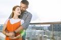 Nice pleasant man hugging his beloved girlfriend Royalty Free Stock Photo