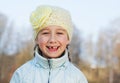 Happy toothless girl outdoors