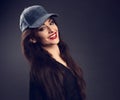 Happy toothy smiling beautiful brunette woman in baseball blue c Royalty Free Stock Photo