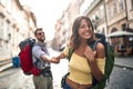 Happy tourist couple sightseeing; Traveller lifestyle