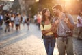 Happy tourist couple sightseeing; Traveller lifestyle