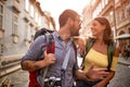 Happy tourist couple sightseeing; Traveller lifestyle