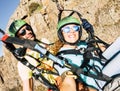 Happy tourist doing paragliding sport activity in outdoor leisure active lifestyle. Cheerful adult woman doing selfie picture Royalty Free Stock Photo
