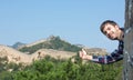 Happy tourist on the Great Wall of China Royalty Free Stock Photo