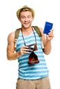 Happy tourist holding passport retro camera isolated on white