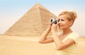 Happy Tourist and Pyramid, Cairo, Egypt. Cheerful Young Blonde