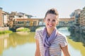 Happy tourist standing on the bridge overlooking Ponte Vecchio Royalty Free Stock Photo