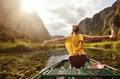 Happy tourist, travels along river Ngo with beautiful algae