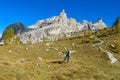 Happy tourist trekker girl in Dolomites mountains in autumn Royalty Free Stock Photo