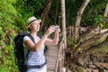 Happy tourist on vacation photographs beautiful landscapes Royalty Free Stock Photo