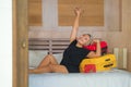 Happy tourist woman arriving in hotel room. Excited and attractive middle aged 40s to 50s lady with grey hair and classy dress Royalty Free Stock Photo