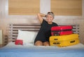 Happy tourist woman arriving in hotel room. Excited and attractive middle aged 40s to 50s lady with grey hair and classy dress Royalty Free Stock Photo