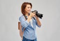 Happy tourist woman with backpack and camera Royalty Free Stock Photo