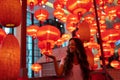 Woman enjoying traditional red lanterns decorated for Chinese new year Chunjie Royalty Free Stock Photo