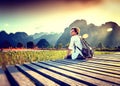 Happy tourist woman meets a sunset overlooking the mountains and Royalty Free Stock Photo