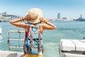 Tourist woman traveler standing on cruise ship or ferry boat Royalty Free Stock Photo