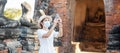 Happy tourist woman wearing surgical face mask and taking Photo by mobile smartphone, protection COVID-19 pandemic during visiting Royalty Free Stock Photo