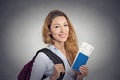 Happy tourist young woman holding passport holiday flight ticket