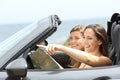 Happy tourists in a car consulting guide on vacations