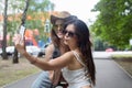 Happy tourists girl friends taking selfie photos Royalty Free Stock Photo