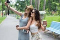 Happy tourists girl friends taking selfie photos Royalty Free Stock Photo