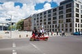 Happy tourists ride a velomobile