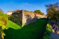 Happy tourists visiting medieval castle