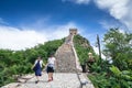 Happy tourists walking along the Great Wall of China Royalty Free Stock Photo