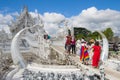 Happy tourists at the White Temple. Chiang Rai