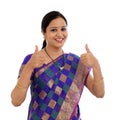 Happy traditional woman making thumbs up gesture Royalty Free Stock Photo