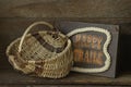 Happy Trails sign with antique reed gathering basket. Royalty Free Stock Photo