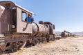 Happy train locomotive driver waving hello, Bolivia trains cemetery