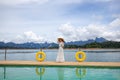 Happy Travel Girl Fun on Wooden Pier with Lake, Rainforest Jungle and Mountains