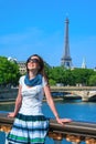 Happy travel girl on the Pont Alexandre III bridge with Eiffel Tower in Paris Royalty Free Stock Photo