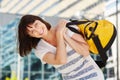 Happy traveler carrying duffel bag over shoulder Royalty Free Stock Photo