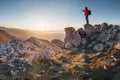 A happy traveler on a mountain top