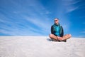 Happy traveler relax among sand dunes