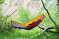 Happy traveler is relaxing in hammock Royalty Free Stock Photo