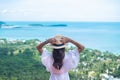 Happy traveler woman enjoy Koh Samui view point, alone Tourist standing and relaxing over ocean in Southern Thailand. Southeast Royalty Free Stock Photo