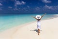 Happy traveler woman enjoys her summer vacation on a tropical beach Royalty Free Stock Photo