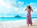 Happy traveler woman enjoys her tropical beach vacation Royalty Free Stock Photo