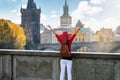 A happy traveler woman enjoys the view to the cityscape of Prague, Czech Republic Royalty Free Stock Photo