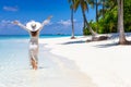 Traveler woman enjoys her tropical beach vacation Royalty Free Stock Photo