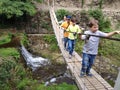 Happy travelers, family on the suspension bridge Royalty Free Stock Photo