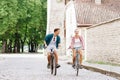 Happy traveling couple riding on bicycles.