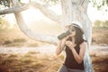 Happy traveller asian woman drinking water from the bottle in sunset time at forest,Lifestyle travel outdoor concept Royalty Free Stock Photo